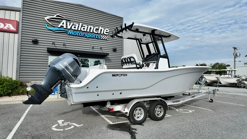 Slide: The Image of 2025 Sea Fox 248 Commander boat on trailer at Avalanche Motorsports dealership. - 2