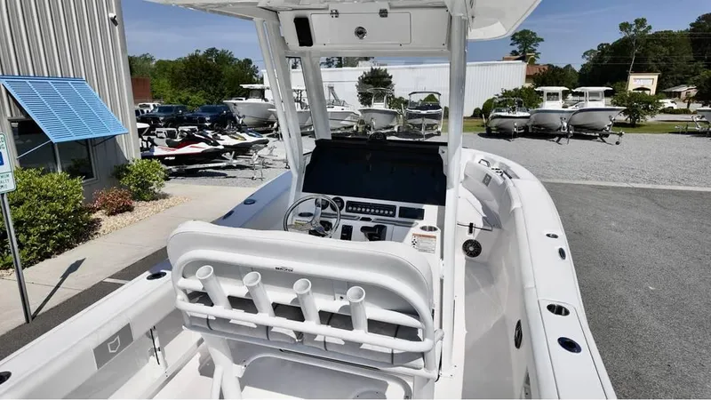Slide: The Image of 2025 Sea Fox 248 Commander boat interior with helm, rod holders, and console display. - 21