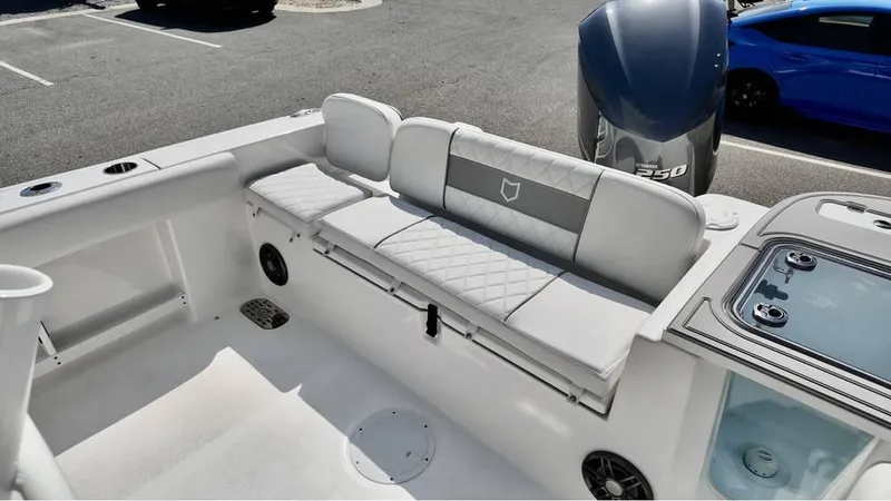 Slide: The Image of 2025 Sea Fox 248 Commander boat interior with cushioned seating and modern design. - 7