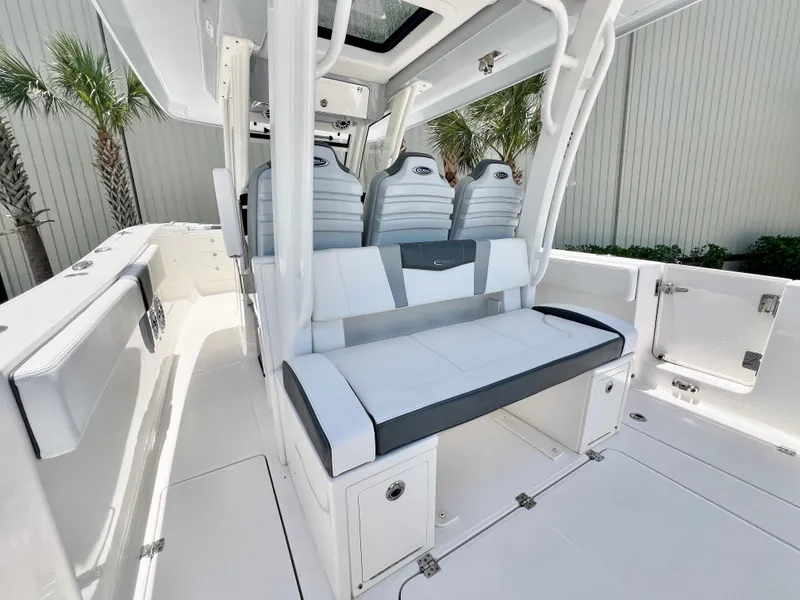 Slide: The Image of 2021 Robalo R360 Center Console boat interior with sleek seating and modern design. - 12