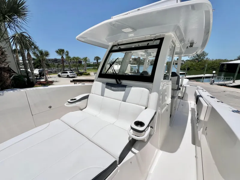 Slide: The Image of 2021 Robalo R360 Center Console boat with spacious seating and modern design. - 20