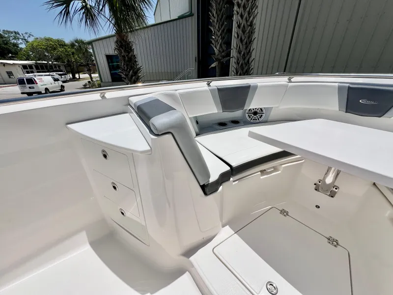 Slide: The Image of 2021 Robalo R360 Center Console boat interior with seating and storage compartments. - 23