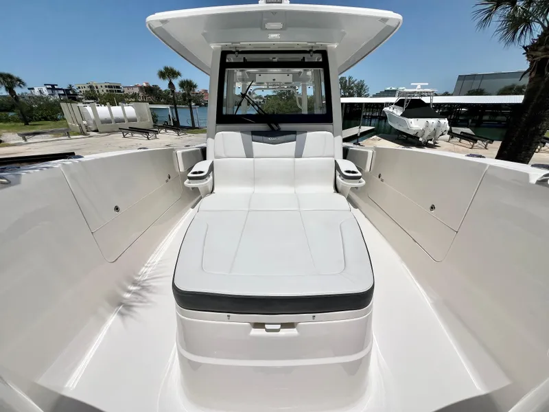 Slide: The Image of 2021 Robalo R360 Center Console boat with spacious seating and sleek design. - 26