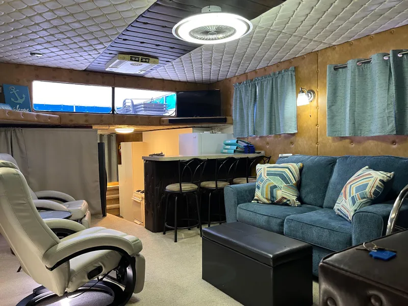 Slide: The Image of Cozy 1987 Sumerset Custom interior with seating, bar stools, and modern lighting. - 10