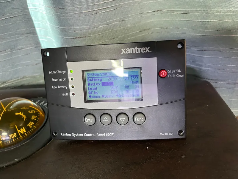 Slide: The Image of Xantrex system control panel on 1987 Sumerset Custom boat, displaying battery and AC information. - 17