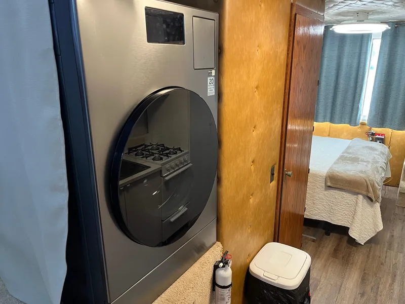 Slide: The Image of Interior of a 1987 Sumerset Custom houseboat with modern appliances and cozy bedroom. - 26