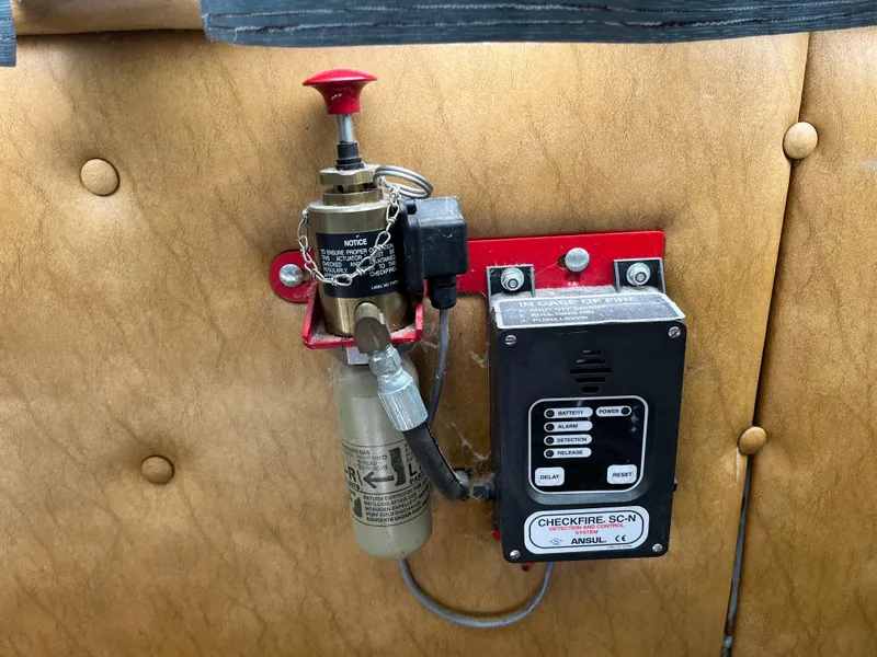 Slide: The Image of Fire suppression system on 1987 Sumerset Custom boat, featuring control panel and extinguisher. - 36