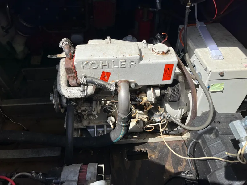 Slide: The Image of 1987 Sumerset Custom engine compartment featuring a Kohler engine. - 38