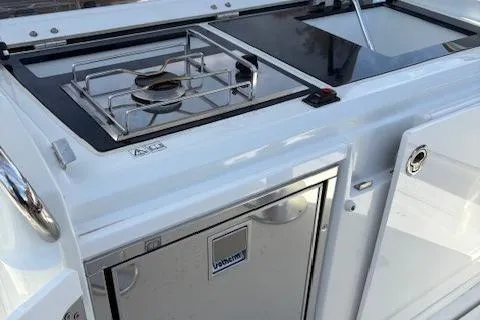 Slide: The Image of Outdoor kitchen on 2020 Jeanneau Leader 9.0 CC boat with stove and sink. - 20