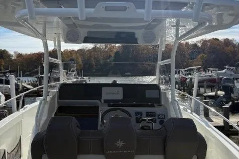 Slide: The Image of 2020 Jeanneau Leader 9.0 CC boat cockpit with Garmin navigation, docked at marina. - 23