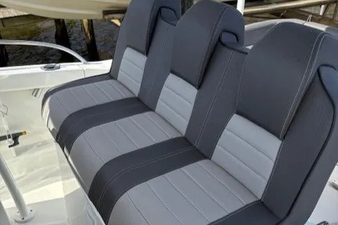 Slide: The Image of 2020 Jeanneau Leader 9.0 CC boat seats, featuring sleek gray and black upholstery. - 24