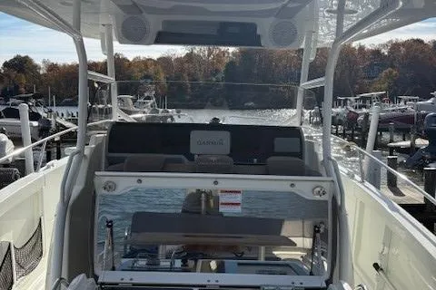 Slide: The Image of 2020 Jeanneau Leader 9.0 CC boat interior with seating, docked at marina. - 25