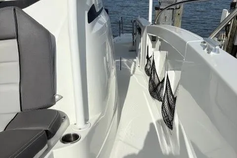 Slide: The Image of 2020 Jeanneau Leader 9.0 CC boat deck with seating and storage nets. - 27