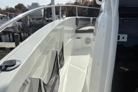 Slide: The Image of 2020 Jeanneau Leader 9.0 CC boat deck with seating and railing. - 28