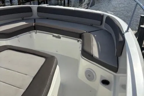 Slide: The Image of 2020 Jeanneau Leader 9.0 CC boat with cushioned seating in the bow area. - 29