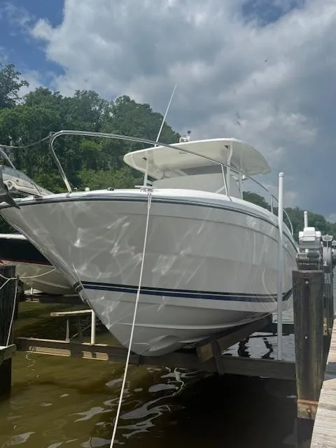 Slide: The Image of 2020 Jeanneau Leader 9.0 CC boat docked under a cloudy sky. - 3