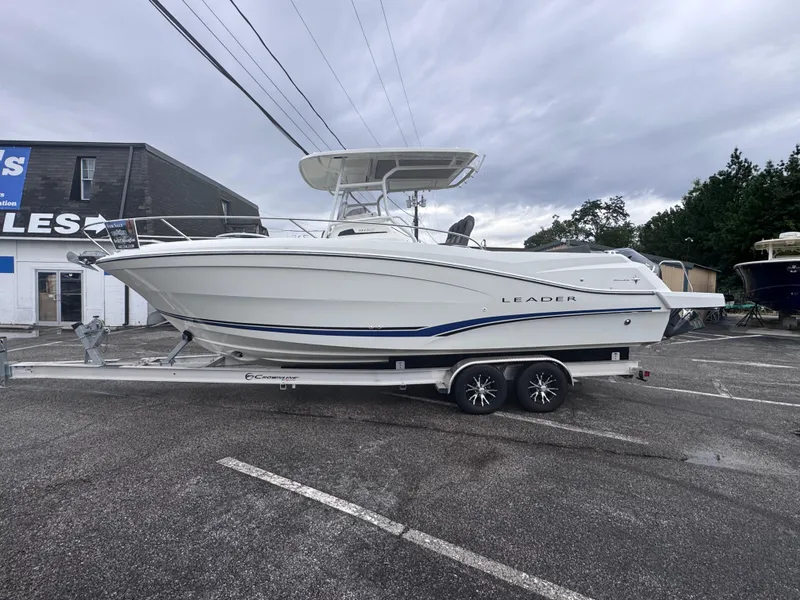 Slide: The Image of 2020 Jeanneau Leader 9.0 CC boat on trailer in parking lot. - 4