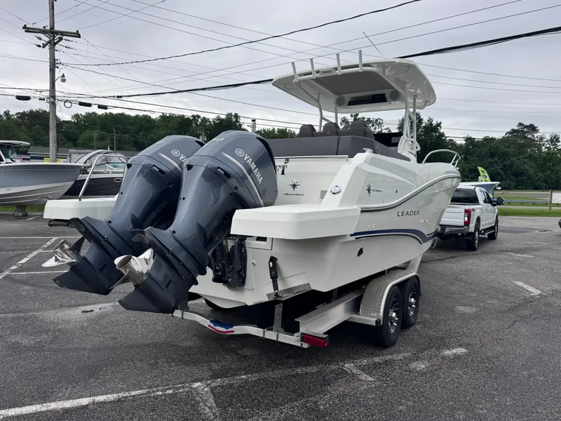 Slide: The Image of 2020 Jeanneau Leader 9.0 CC boat with dual Yamaha engines on a trailer. - 6