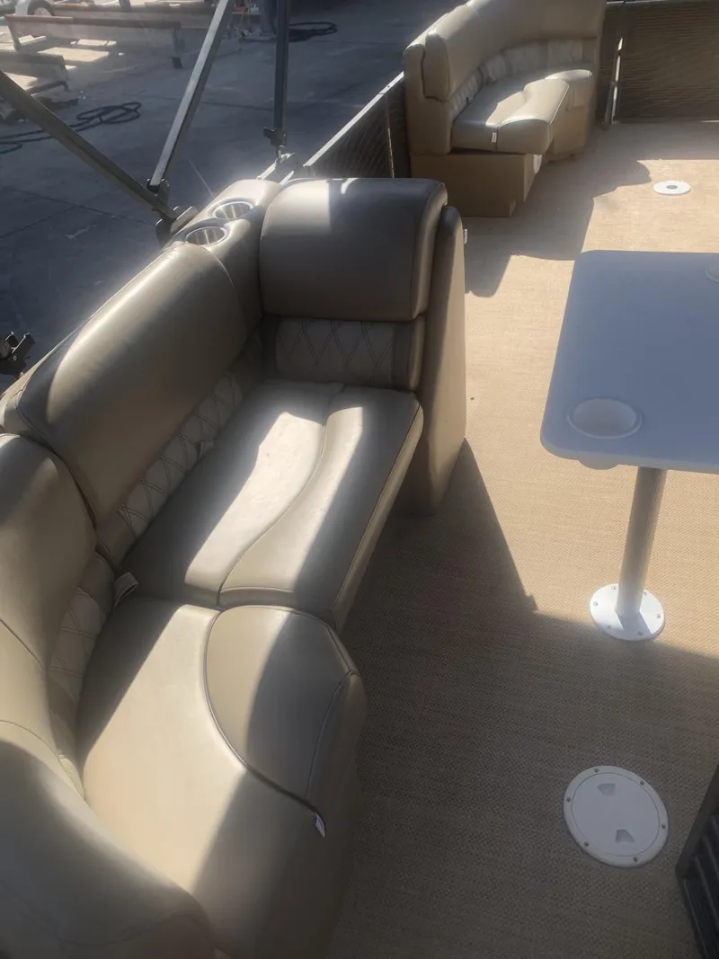 Slide: The Image of 2017 Lexington LML boat interior with beige seating and table. - 10
