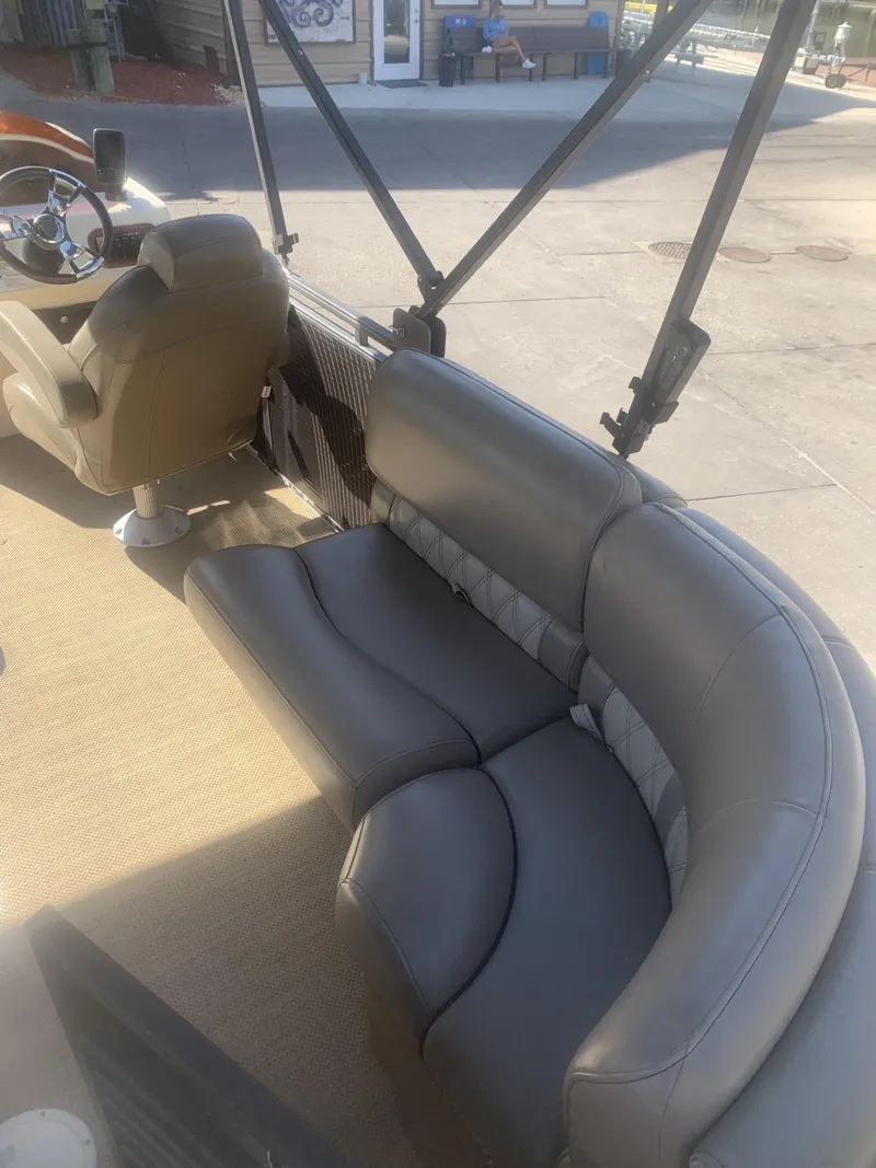 Slide: The Image of 2017 Lexington LML boat interior with gray seating and steering wheel. - 12