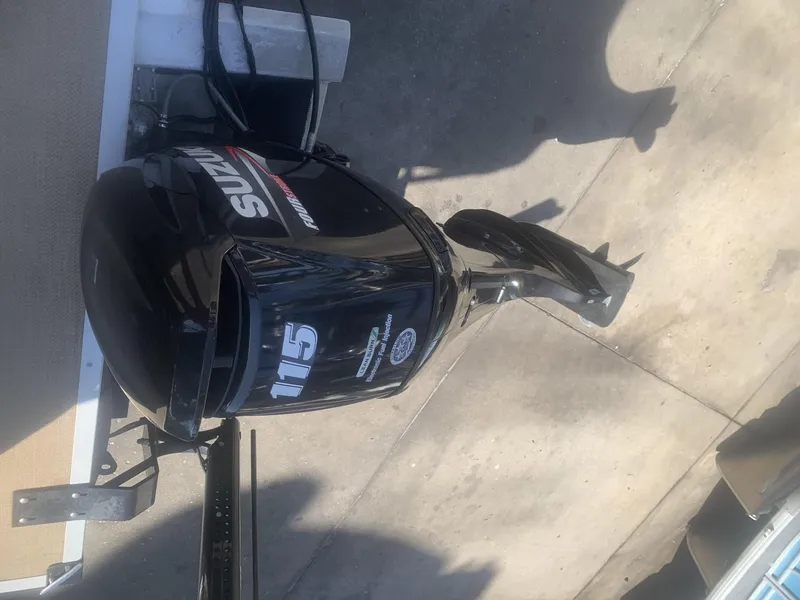 Slide: The Image of Outboard motor on a boat, Lexington LML 2017 model, black with visible branding. - 13