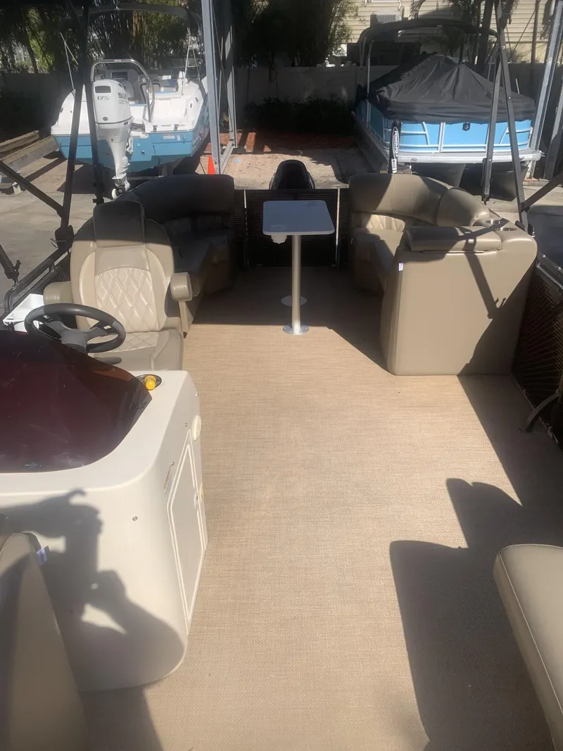 Slide: The Image of 2017 Lexington LML boat interior with beige seating and a central table. - 3