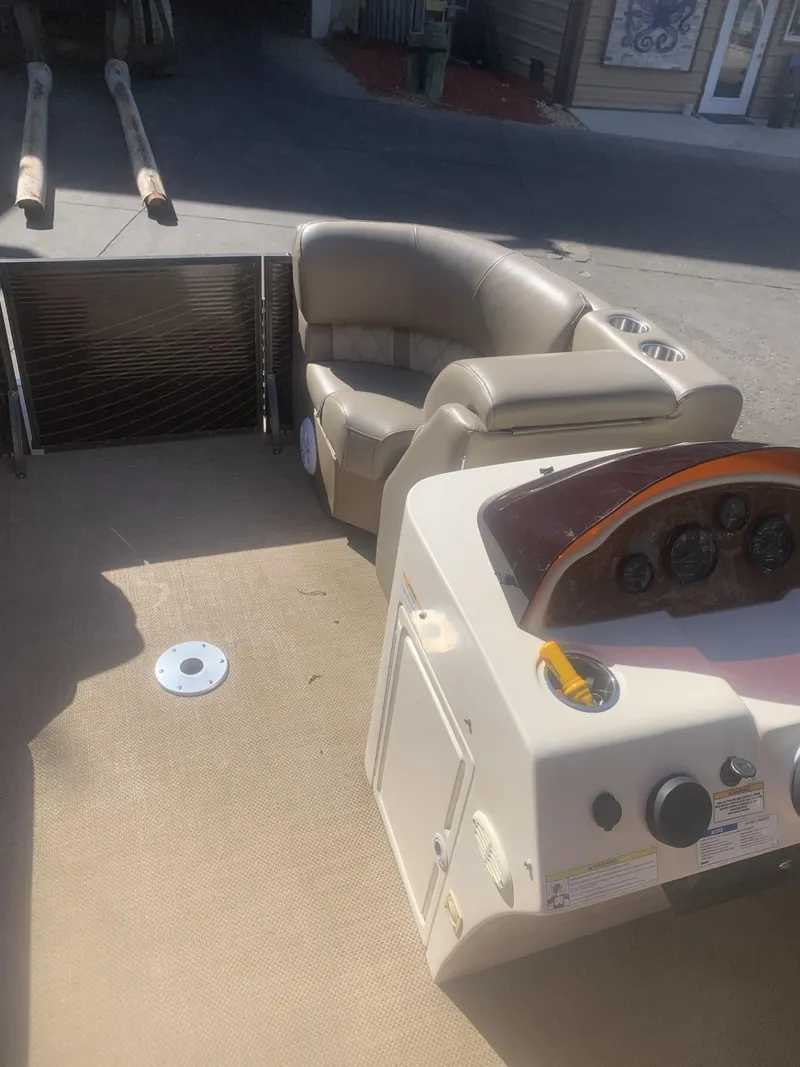 Slide: The Image of 2017 Lexington LML boat interior with beige seating and control panel. - 5