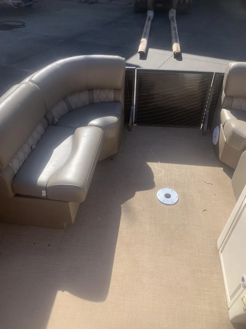 Slide: The Image of 2017 Lexington LML boat interior with beige seating and carpeted floor. - 6