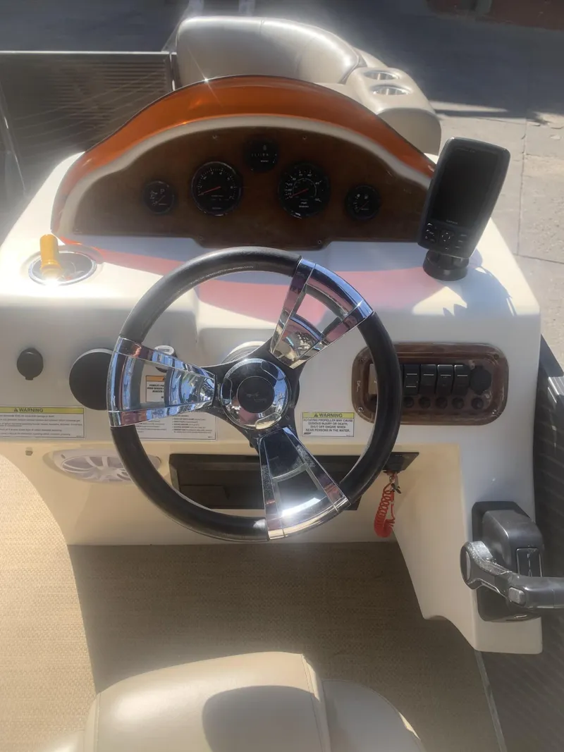 Slide: The Image of Steering console of a 2017 Lexington LML boat with gauges and controls. - 7