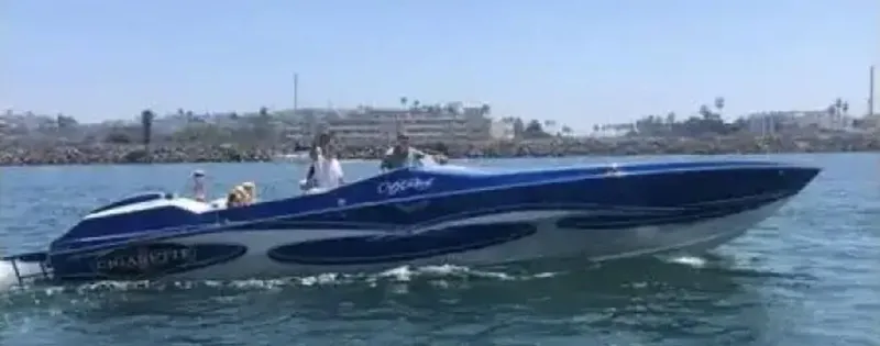 Slide: The Image of 1989 Cigarette 35 Cafe Racer speedboat cruising on a sunny day. - 5