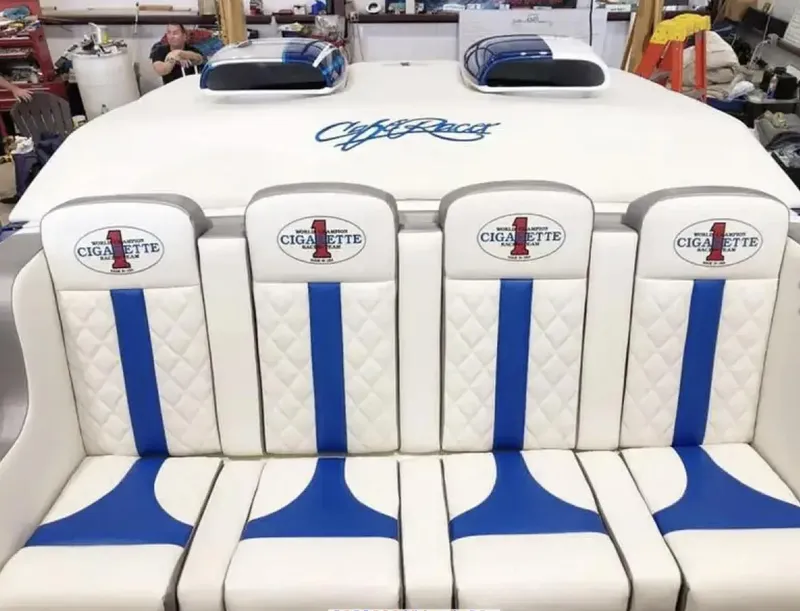 Slide: The Image of 1989 Cigarette 35 Cafe Racer boat interior with blue and white seating. - 7