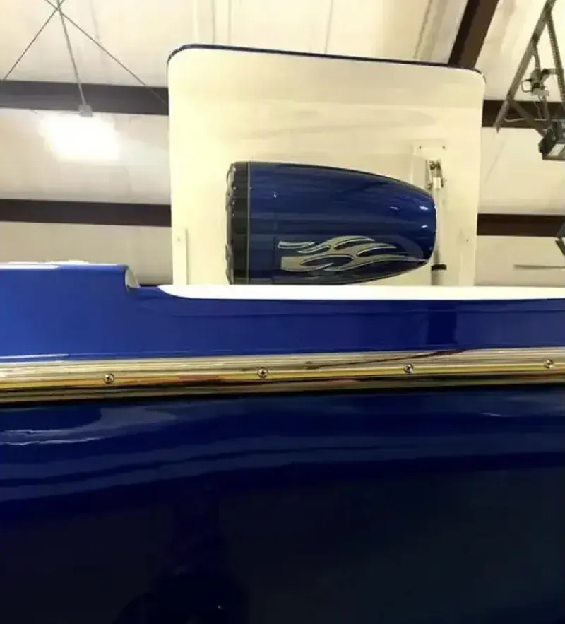 Slide: The Image of 1989 Cigarette 35 Cafe Racer boat with blue exterior and sleek design. - 8