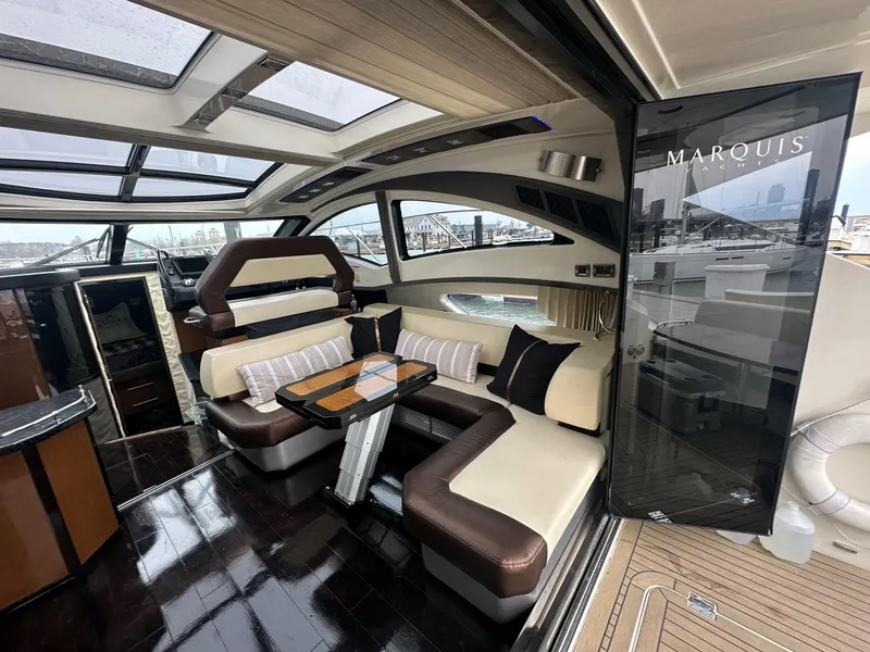 Slide: The Image of Luxurious interior of a 2008 Marquis 40 SC yacht with elegant seating and panoramic windows. - 5