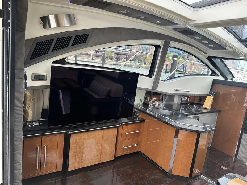 Slide: The Image of Interior of 2008 Marquis 40 SC yacht with modern kitchen and large TV. - 6