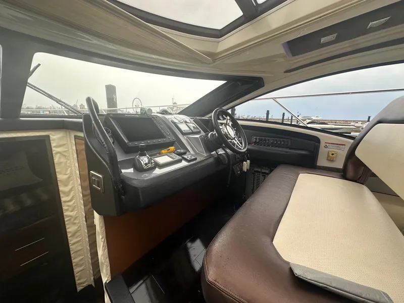 Slide: The Image of Interior view of 2008 Marquis 40 SC yacht cockpit with steering wheel and dashboard. - 9