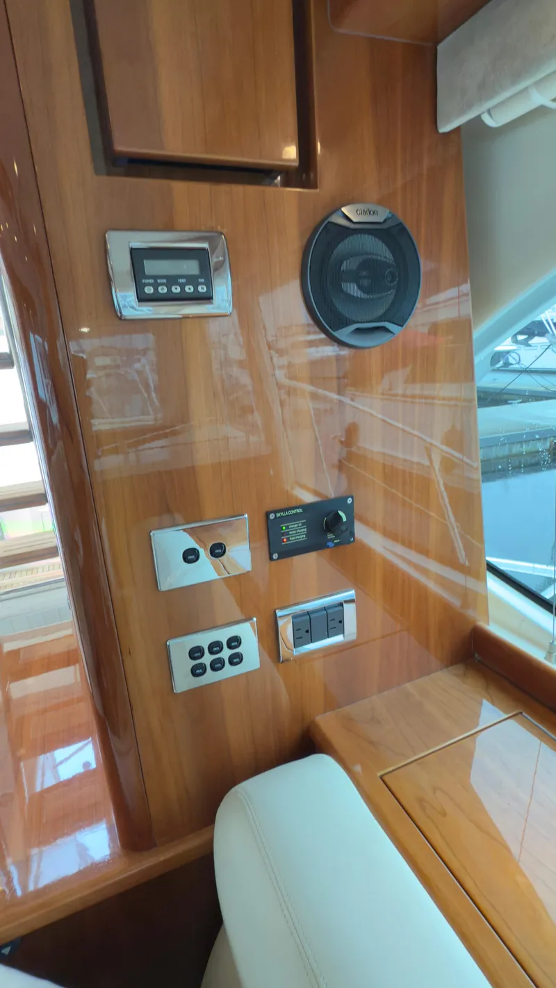 Slide: The Image of Control panel on 2011 Riviera 43 IPS Open Flybridge with wood finish and electronic controls. - 7