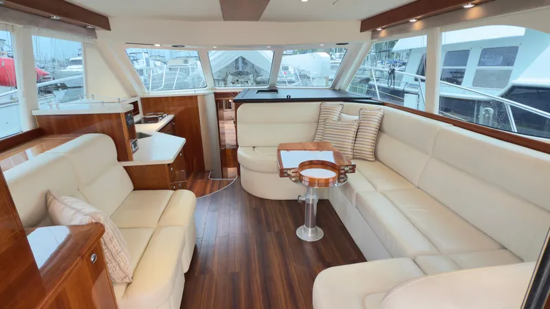 Slide: The Image of Luxurious interior of 2011 Riviera 43 IPS Open Flybridge with plush seating and elegant wood finishes. - 2