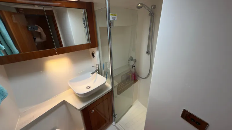Slide: The Image of Luxurious bathroom in 2011 Riviera 43 IPS Open Flybridge yacht with modern fixtures. - 20