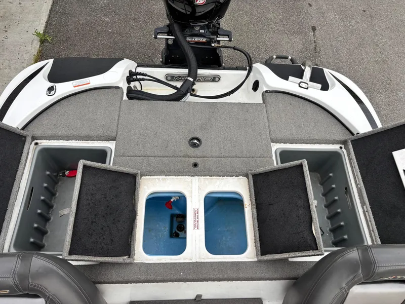Slide: The Image of 2017 Nitro Z18 boat deck with storage compartments and motor. - 12