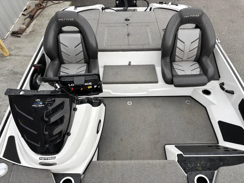 Slide: The Image of 2017 Nitro Z18 boat interior with two seats and fishing equipment. - 8