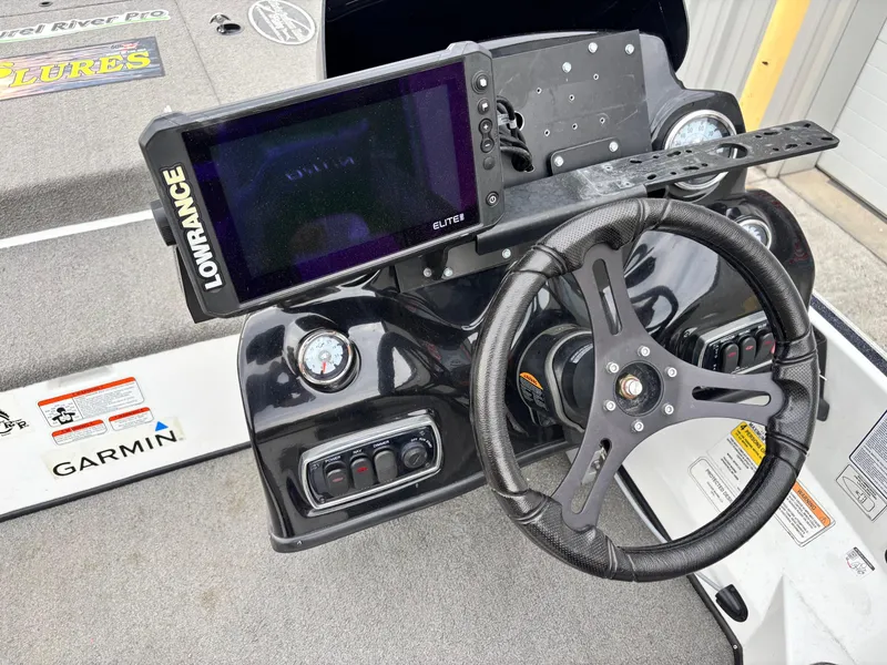 Slide: The Image of Steering console of a 2017 Nitro Z18 boat with Lowrance and Garmin electronics. - 9