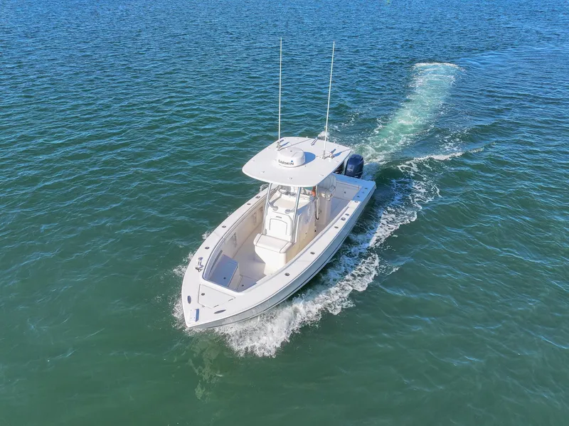 Slide: The Image of 2018 Jupiter 26 FS boat cruising on open water, aerial view. - 10