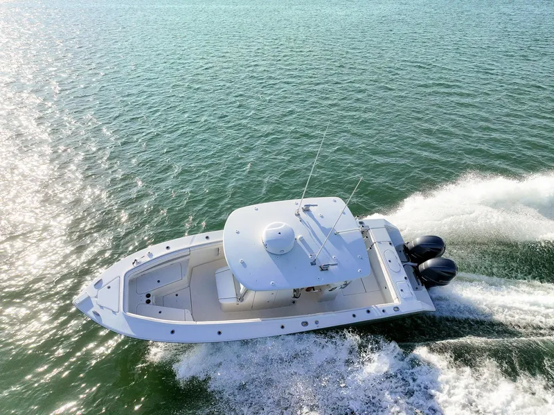 Slide: The Image of Aerial view of 2018 Jupiter 26 FS boat cruising on open water. - 14