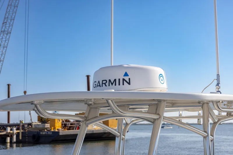Slide: The Image of Garmin radar on 2018 Jupiter 26 FS boat, docked by the water. - 24
