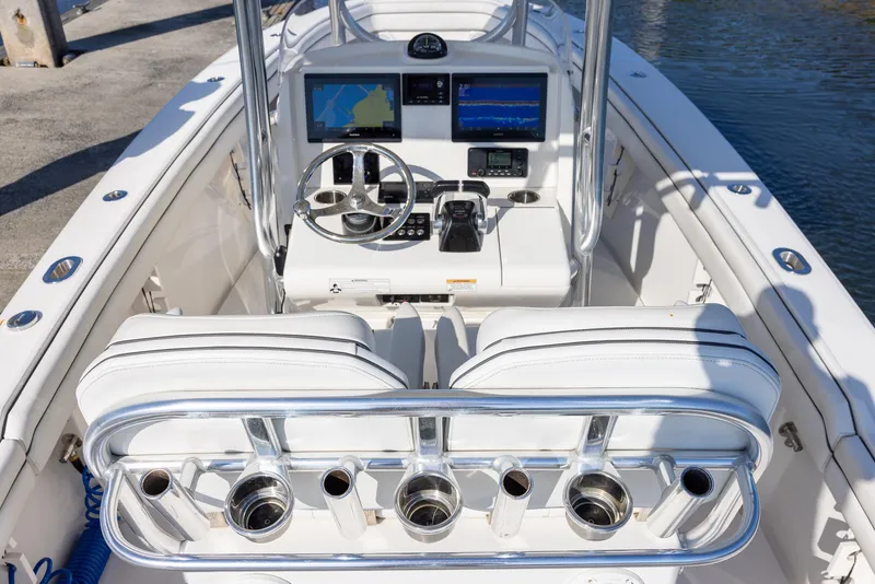 Slide: The Image of 2018 Jupiter 26 FS boat cockpit with modern navigation system and sleek design. - 27