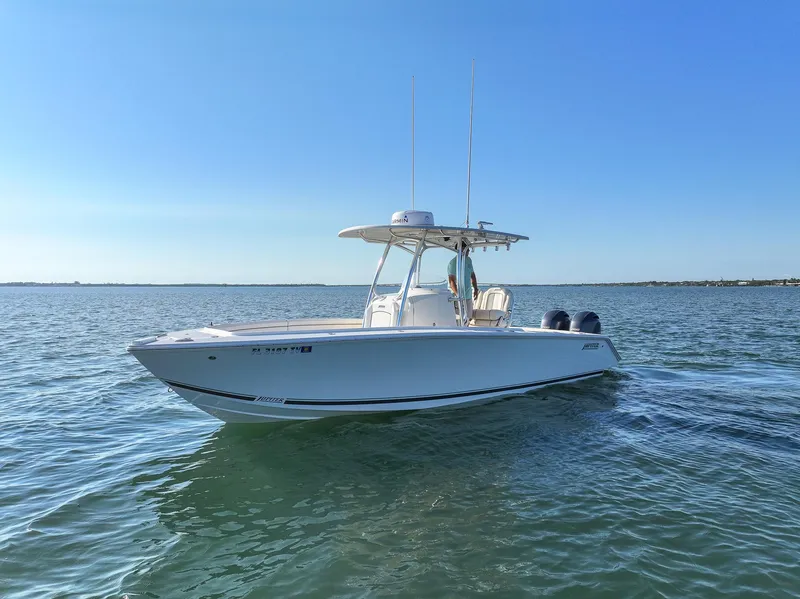 Slide: The Image of 2018 Jupiter 26 FS boat cruising on calm waters under clear blue sky. - 5