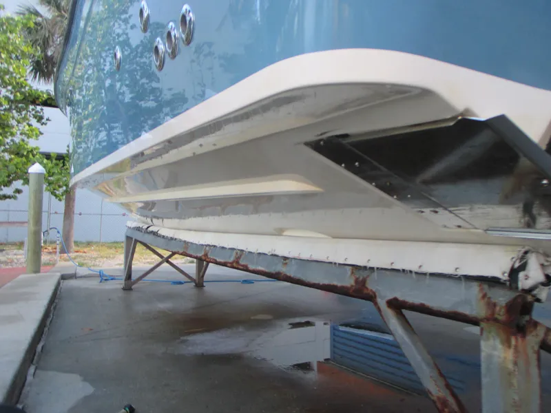 Slide: The Image of 2018 Grady-White Freedom 307 boat hull on a rusted trailer. - 11