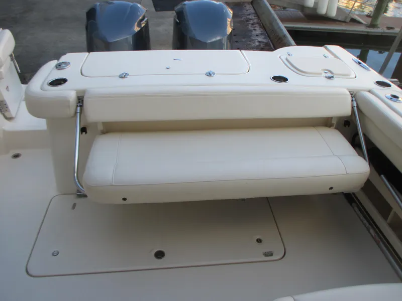 Slide: The Image of 2018 Grady-White Freedom 307 boat with foldable seating and dual outboard motors. - 18