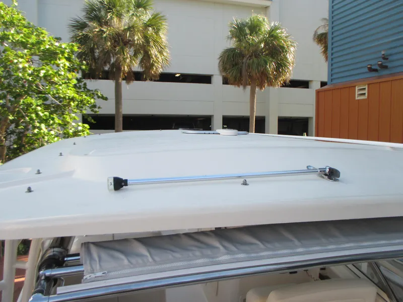 Slide: The Image of 2018 Grady-White Freedom 307 boat roof with palm trees in the background. - 22