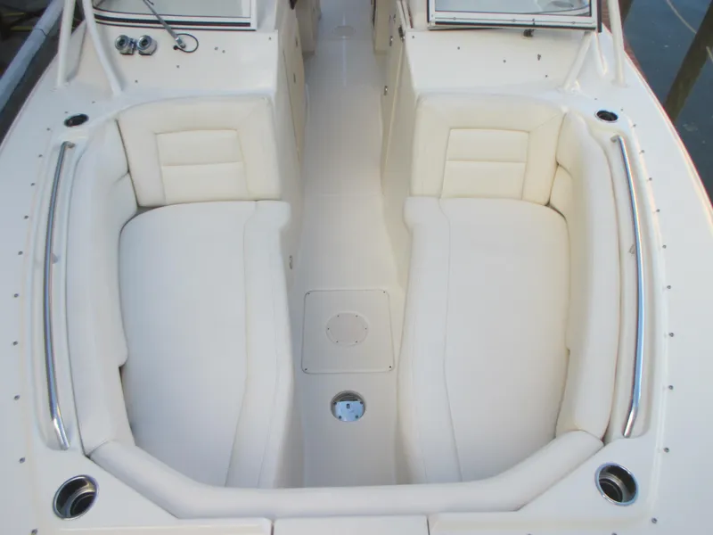 Slide: The Image of 2018 Grady-White Freedom 307 boat interior with white cushioned seating. - 27